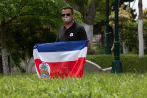 tico walking with costa rica flag