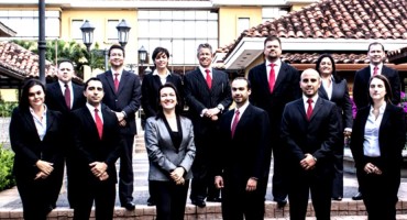 The partners and staff of Arias & Muñoz. Ms. Castro is at front center.