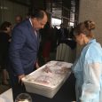 Costa Rican President Luis Guillermo Solís views local seafood products on display at a 'buy local' CNP event.