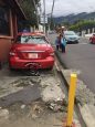 A family in Escazú forced into the street by a taxi parked on a sidewalk, photo published by the Accidentes en Costa Rica Facebook group.