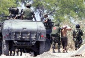 Mexican soldiers fighting the Drug War. Wikimedia Commons