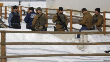 FILE (Reuters OMX) - Members of the Oregon State Troopers and FBI are seen as in Burns, Oregon Jan. 31, 2016. Four armed occupants remain at the Malheur National Wildlife Refuge near Burns.