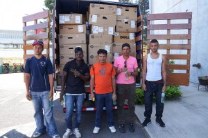 Prisoners prepare to unload computers for their new computer lab. (Photo courtesy of the Ministry of Justice and Peace)