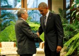 U.S. President Barack Obama and Cuba's President Raul Castro shake hands during their first meeting on the second day of Obama's visit to Cuba, in Havana March 21, 2016. REUTERS/Carlos Barria