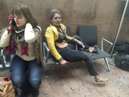 Injured people are seen at the scene of explosions at Zaventem airport near Brussels, Belgium, March 22, 2016. REUTERS/Ketevan Kardava/Courtesy of 1tv.ge/Handout via Reuters