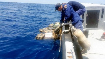 Costa Rican Coast Guard officials were able to recover a significant amount of cocaine that was thrown overboard during the chase. (Photo courtesy of the Costa Rican Coast Guard)