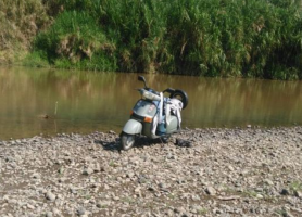 The victim's motor scooter was found parked on the bank of the river. (Facebook / Noticias en linea Puriscal)