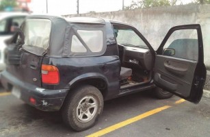 The Italian man's vehicle was left with its doors wide open in a Walmart parking lot after police officers allegedly abducted the man. (OIJ photo)